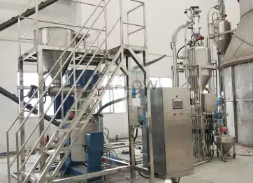 Vacuum feeder connected to mixing production line