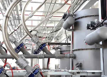 API powder pneumatic conveying system transporting active pharmaceutical ingredient powder through an enclosed stainless steel pipeline