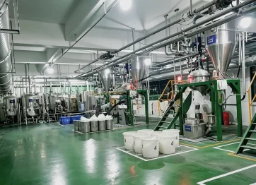 A protein extract pneumatic conveying system provides an enclosed transfer route that can connect upstream powder preparation equipment with downstream pharmaceutical processing machinery